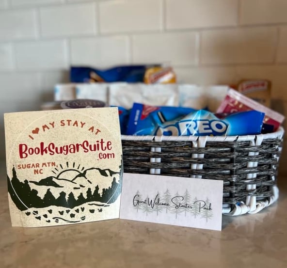 Airbnb welcome basket with branded sticker and snacks